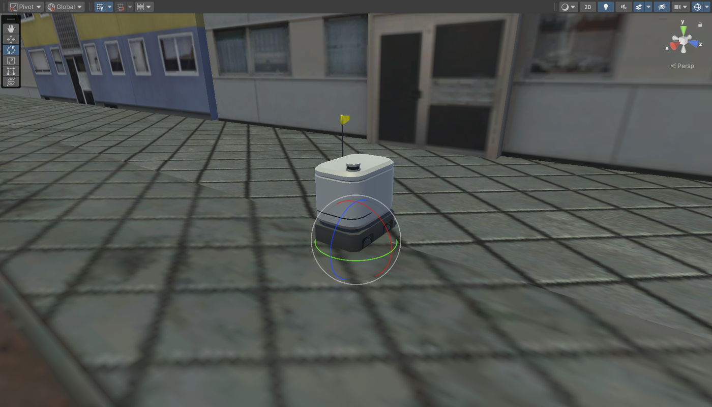 Delivery robot placed on the sidewalk next to the crosswalk, selected with the Rotate tool
